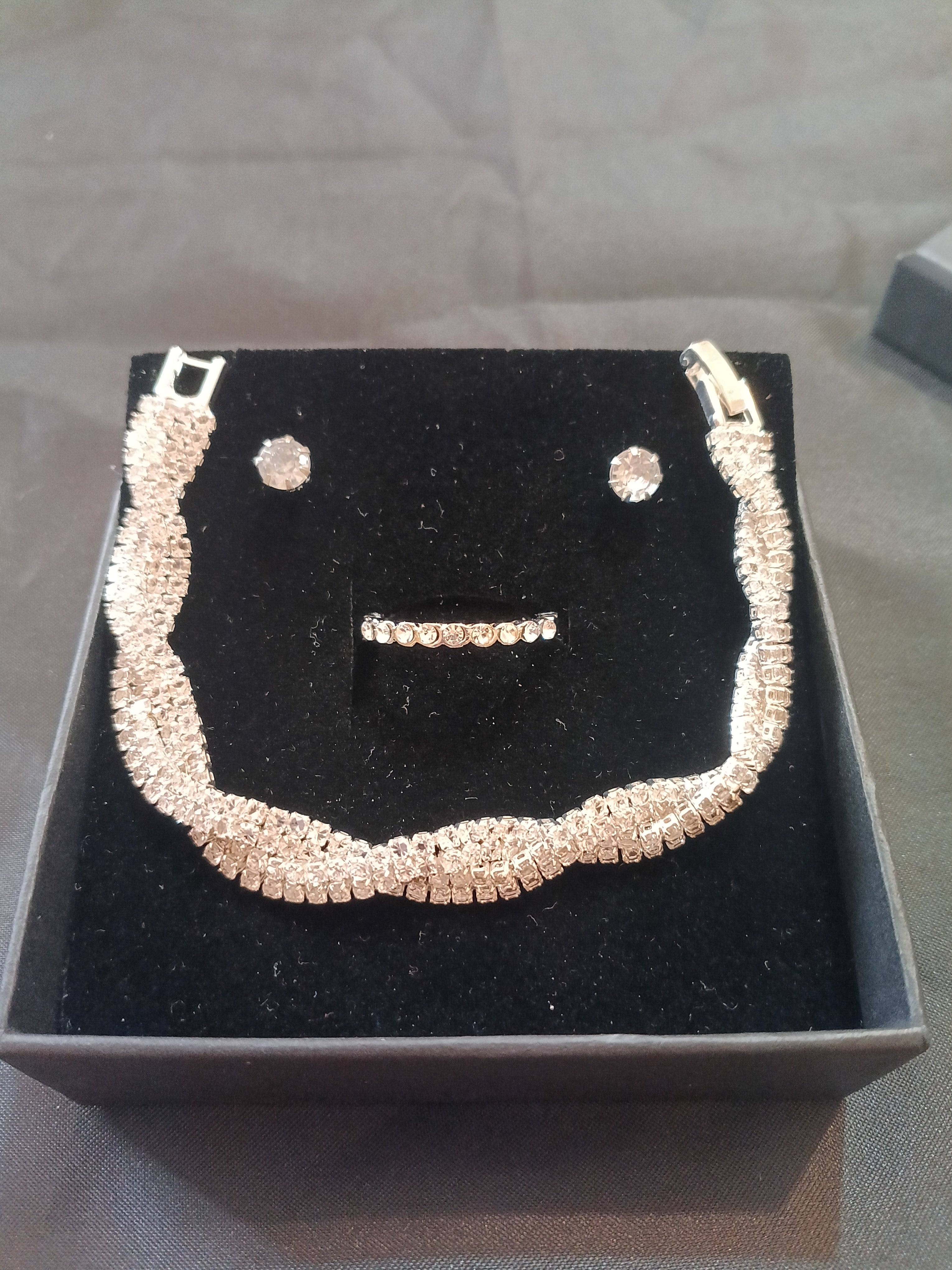 Set Bracciale Tennis Intrecciato Argento con Orecchini e Anello