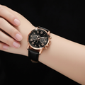 Orologio nero oro rosa al polso